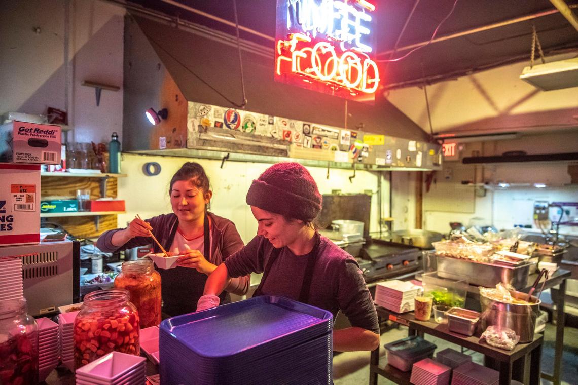 Esther Frances, left, and Leandra Forman, the duo behind Meh Rong, serve up Korean comfort food Jan. 19 during a pop-up dinner at Lexington’s Best Friend Bar.