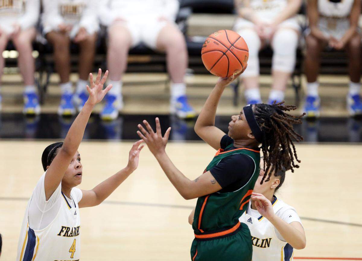 MK Bennett, shooting, is part of a youthful Frederick Douglass roster that will open play in the Sweet 16 on Wednesday night against Simon Kenton.