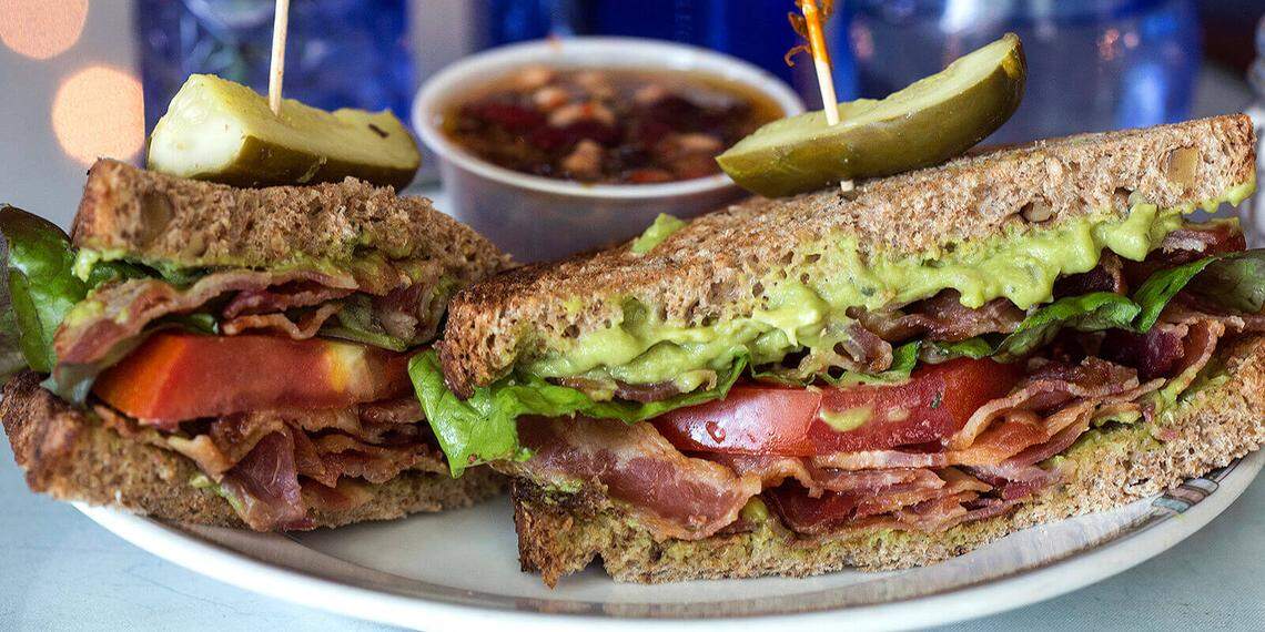 The Queen Anne sandwich from the Café features homemade Benedictine cucumber spread served on artisan walnut wheat bread and garnished with sliced cucumbers, bacon and lettuce.