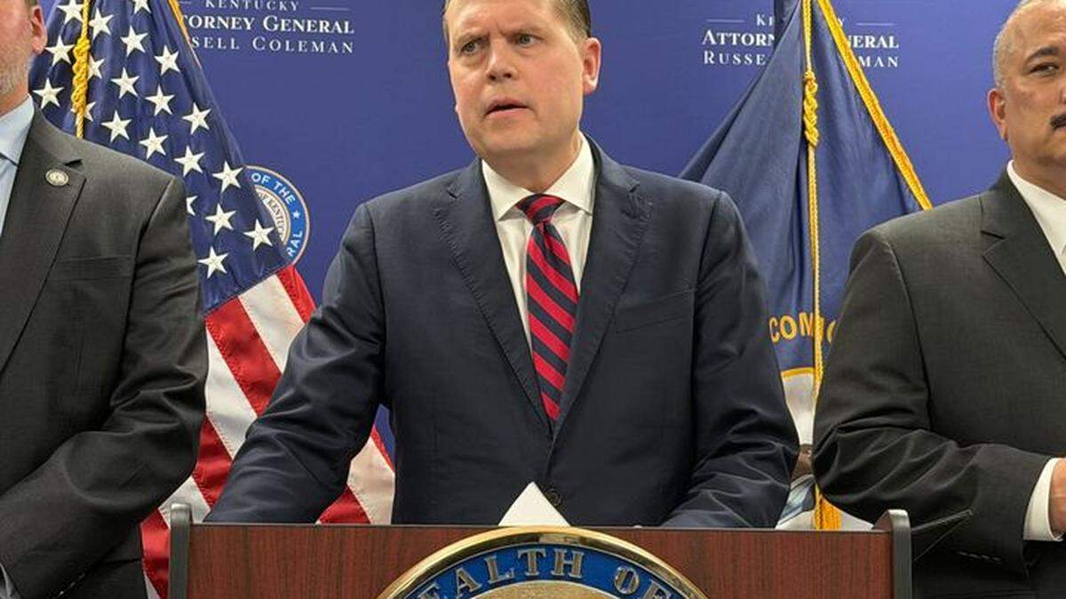 Kentucky Attorney General Russell Coleman speaks at a news conference in Frankfort March 31, 2026, announcing four felony charges related to campaign finance violations against London Mayor Randall Weddle.
