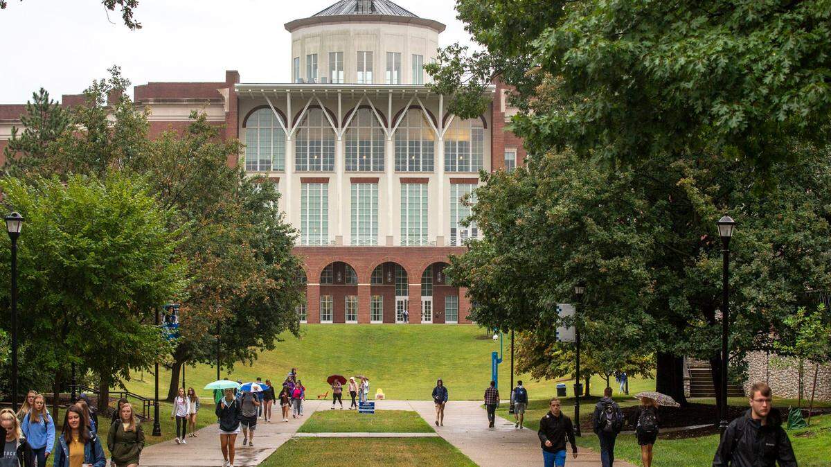 Students walk along the University of Kentucky campus on Monday, Aug. 26, 2019, the first day of classes for the fall semester in Lexington, Ky.