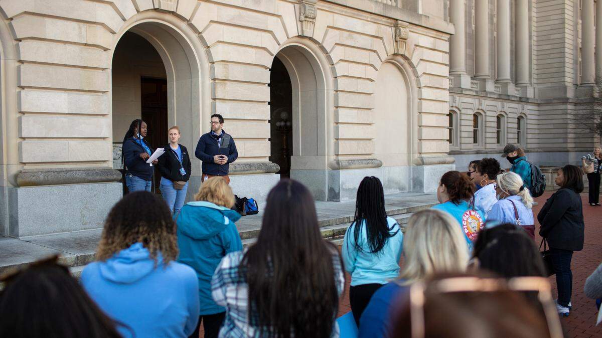 Shawnte West speaks to members of the DCBS social service workers gather at the capitol to protest pay rates and staffing shortages in their ranks at the capitol in Frankfort, Ky., Monday, November 15, 2021. The group also sat in on a joint House-Senate budget committee in an effort to make their presence felt.