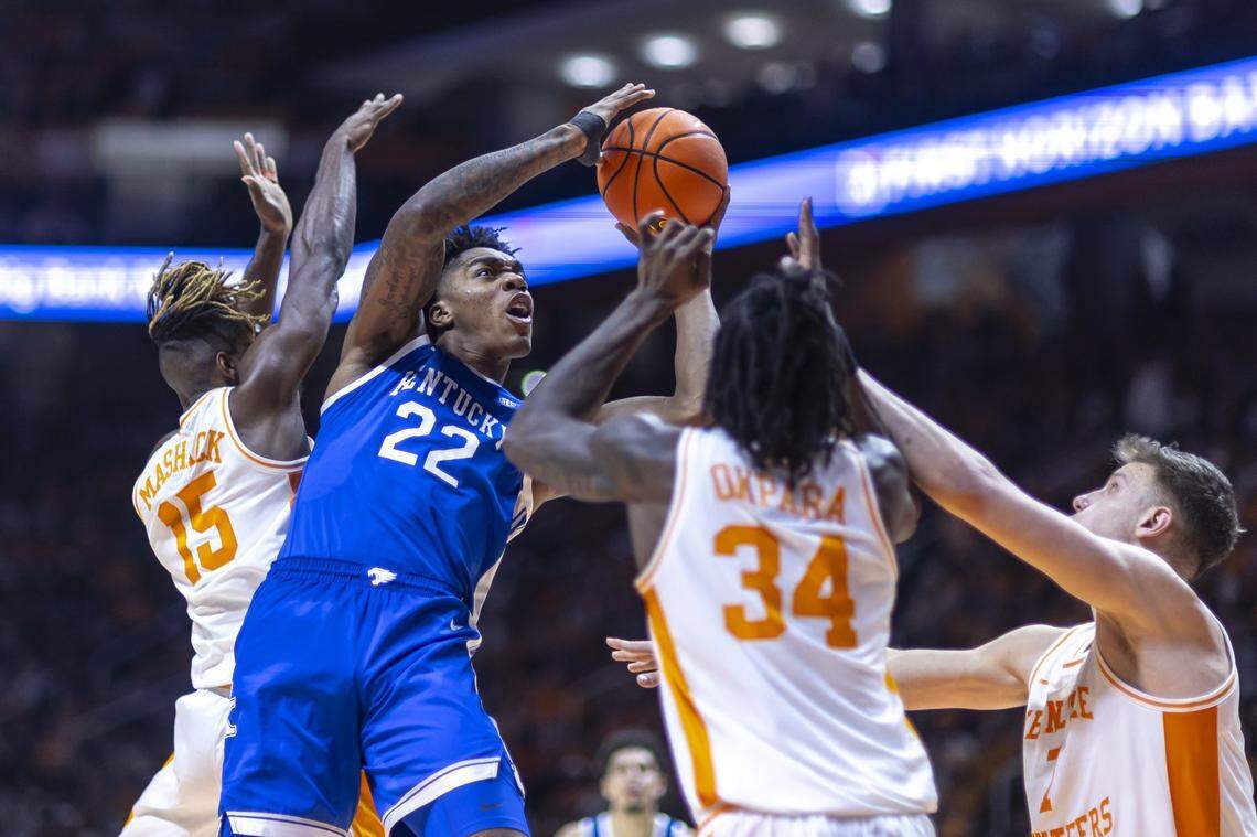 Kentucky center Amari Williams (22) looks to shoot the ball as Tennessee guard Jahmai Mashack (15), guard Gavin Paull (24) and forward Igor Milicic Jr. (7) defend during Tuesday’s game at Thompson-Boling Arena in Knoxville, Tenn.
