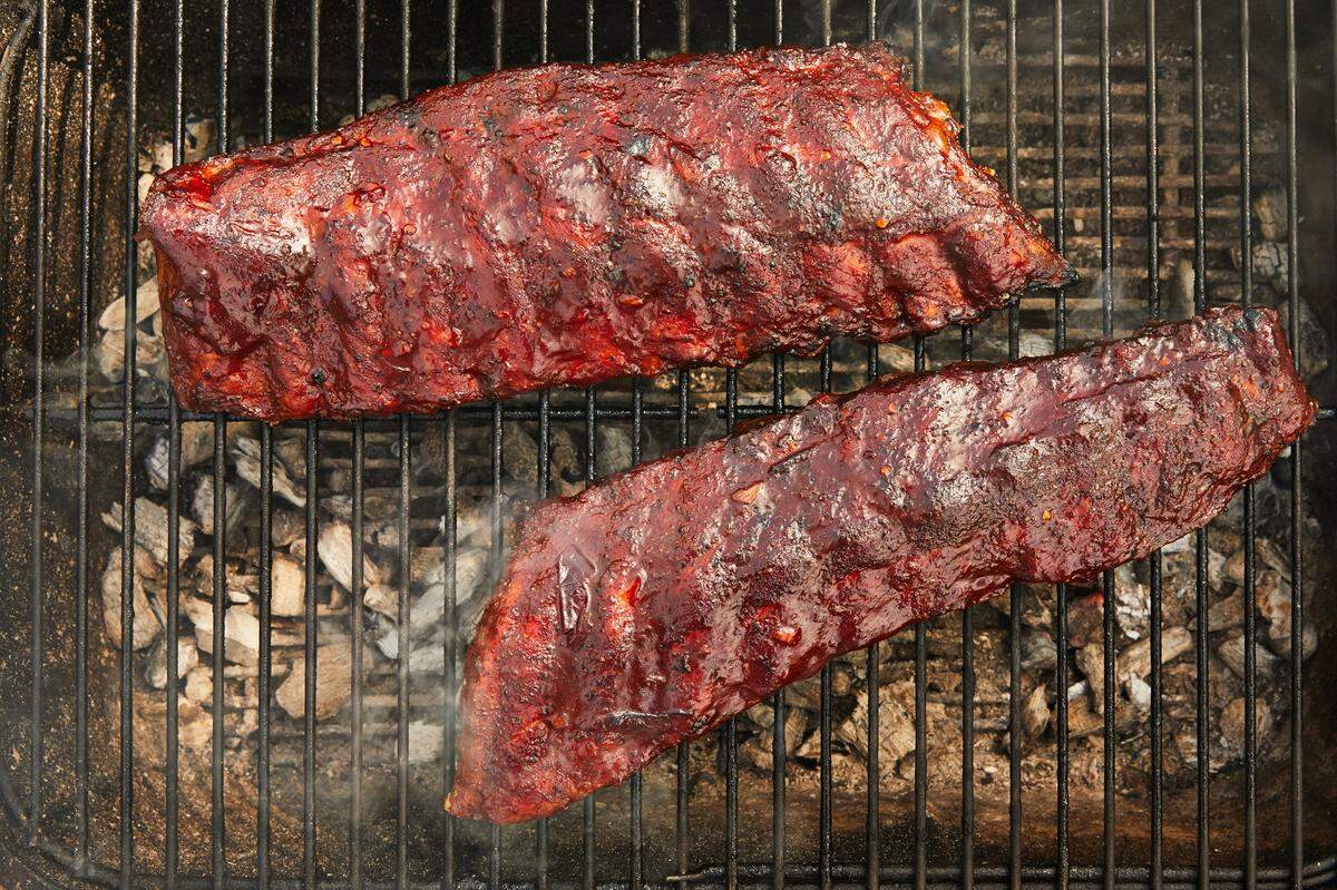 The chipotle-bourbon barbecue sauce goes on during the last 20 minutes of cooking, then applied again and seared into the meat over high heat, and finally served with the ribs for spooning or dipping.