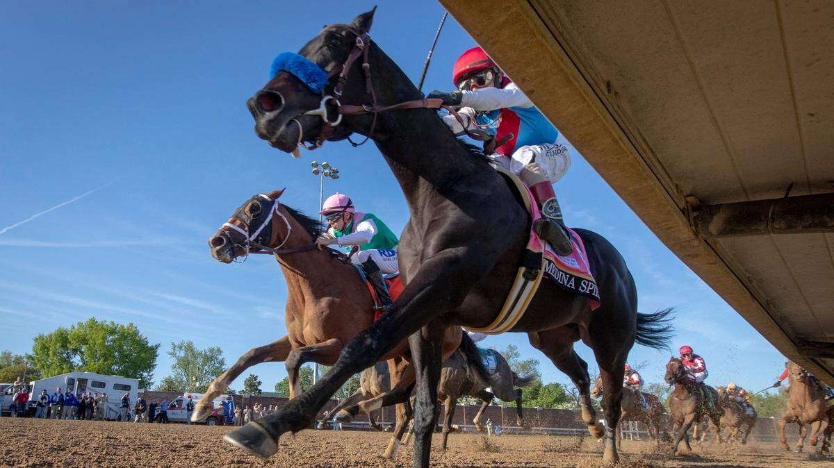 Derby winner Medina Spirit with John Velazquez on board (inside by rail) comes out of turn 4 as Mandaloun with jockey Florent Geroux in hot pursuit at the 147th running of the Kentucky Derby at Churchill Downs on Saturday, May 1, 2021 in Louisville, Ky.
