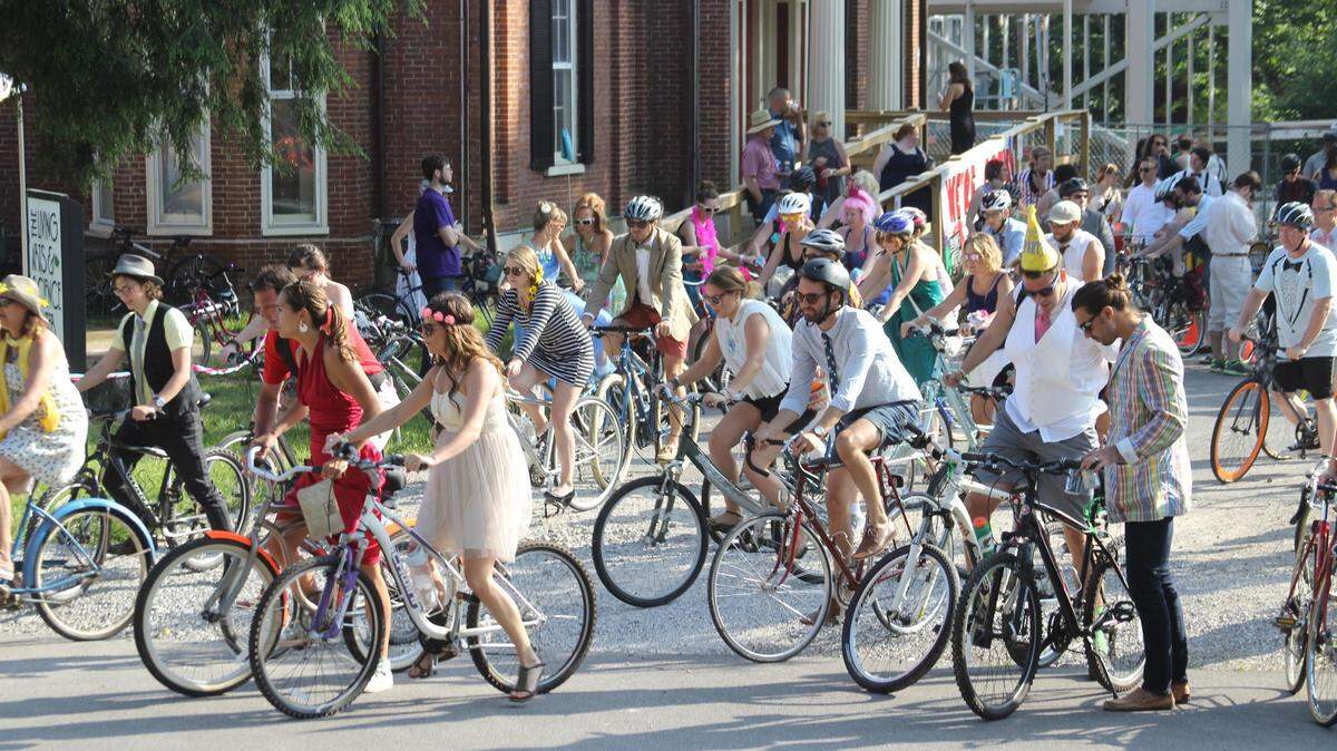 Hundreds of riders participated in Bike Prom 2015 to benefit the Living Arts & Science Center. This year’s “Sgt. Peppers”-theme event is Saturday.