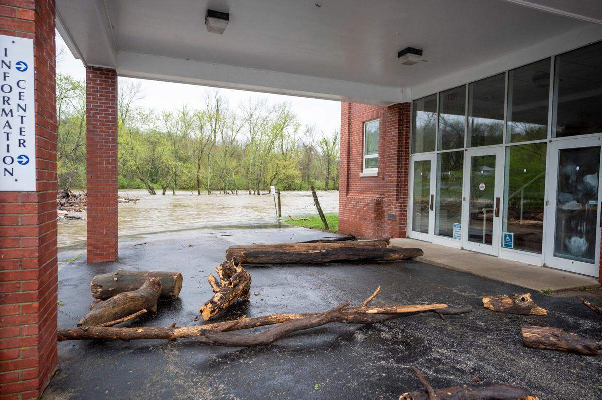 The parking lot of Ambassador’s for Christ Ministries parking lot had debris and flood water near the Forks of the Elkhorn , Sunday April 6, 2025 in Frankfort, Ky. Photo by Mark Mahan