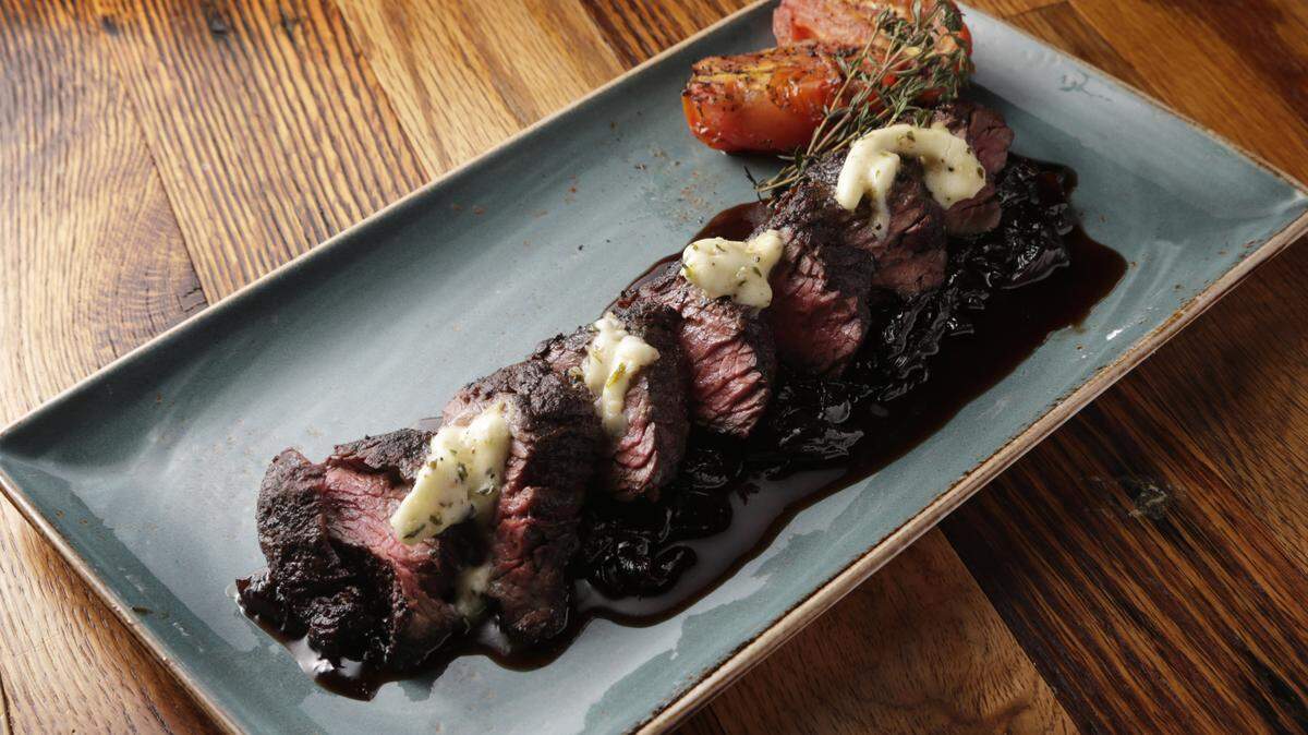 Grilled hanger steak is served over a cabernet onion marmalade at OBC Kitchen.