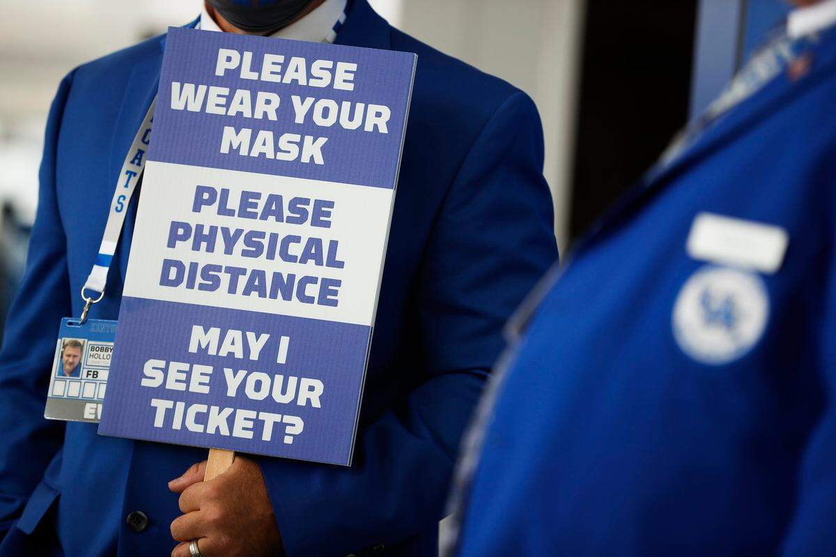Bobby Hollon of Winchester, a greeter at the stadium, waited for fans before Saturday’s game between Kentucky and Mississippi at Kroger Field.