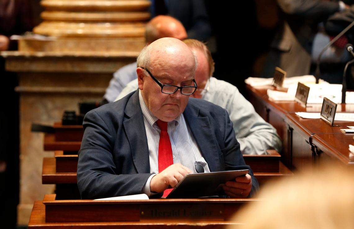 Lexington Herald-Leader reporter Jack Brammer at his desk on the floor of the Senate Chambers in the State Capitol in Frankfort, Ky.