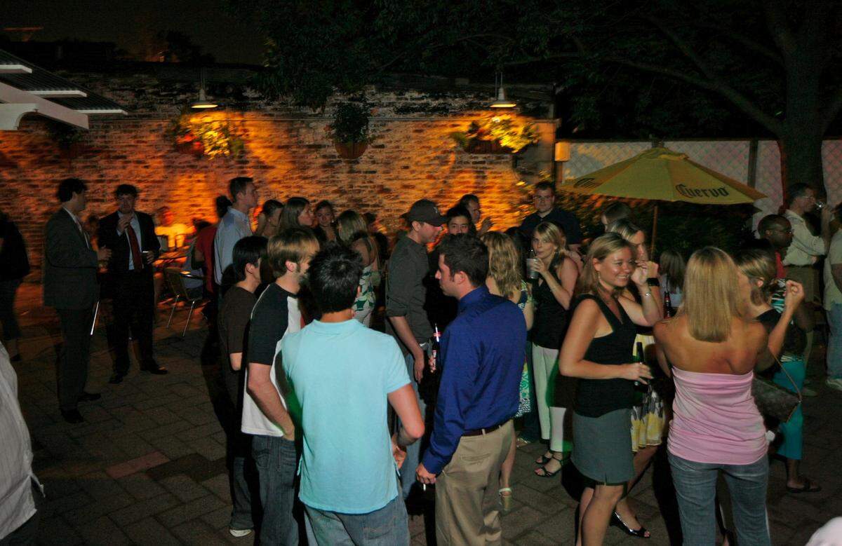 Atomic Cafe’s brick-paved patio with an outdoor bar made it a popular summer drinking destination. It was tucked behind the restaurant and dotted with live plants with plenty of tables for dining. Crowds would typically be strong on the weekends for live music.
