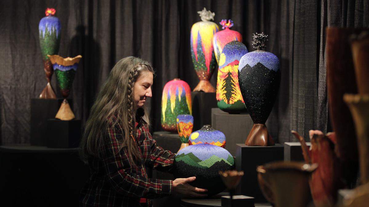 Linda Fifield of Jackson County sold beaded vases and art last year at  Kentucky Crafted: The Market. Her husband, Jack, who does wood-turning, shared the booth.  