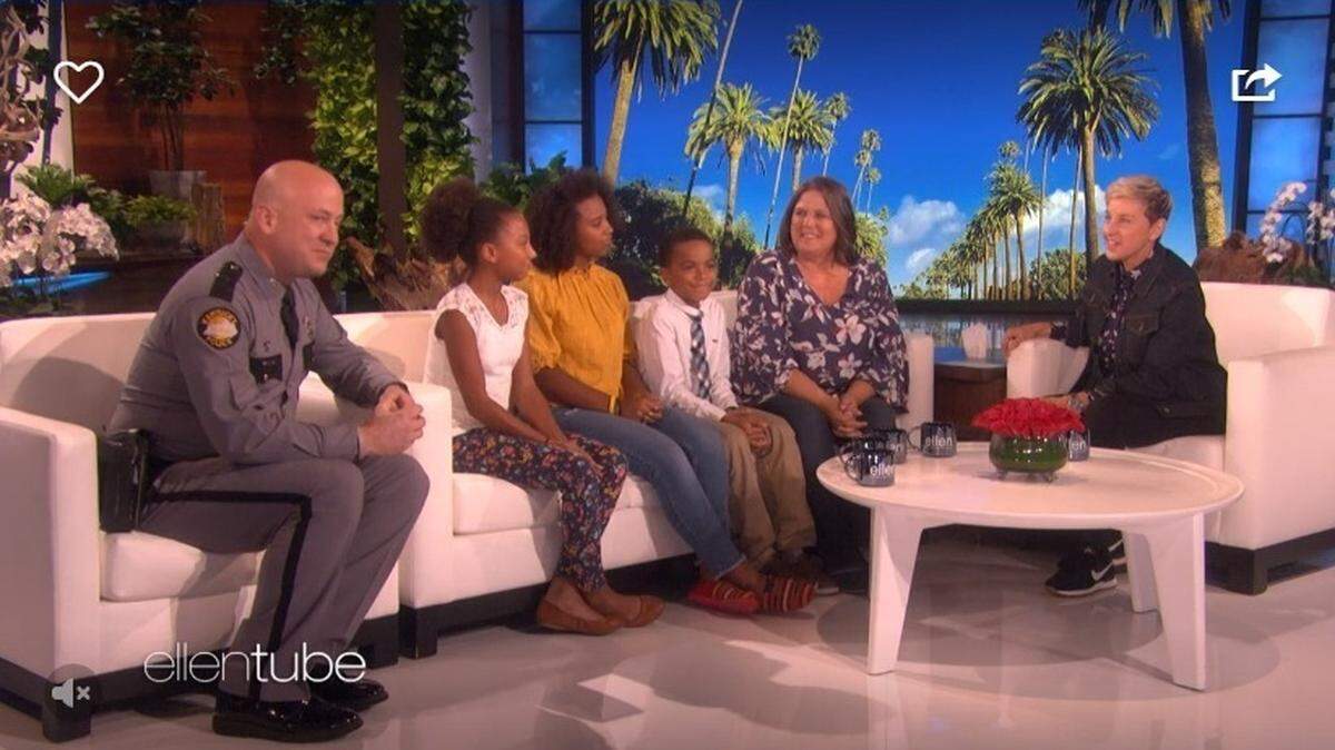 Kentucky State Police Trooper Josh Satterly (left) appeared on “The Ellen Show” as a surprise for the family of Koeberle Bull, who helped stop a school attack in Kentucky earlier this month.