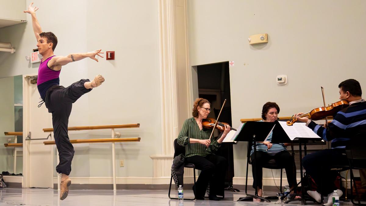 Dancers rehearse with the Lexington Philharmonic string quartet.