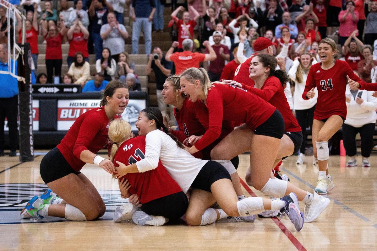 Paul Laurence Dunbar players celebrate after defeating Great Crossing 3-1 in high school volleyball’s 11th Region Tournament championship game at Paul Laurence Dunbar High School on Thursday.