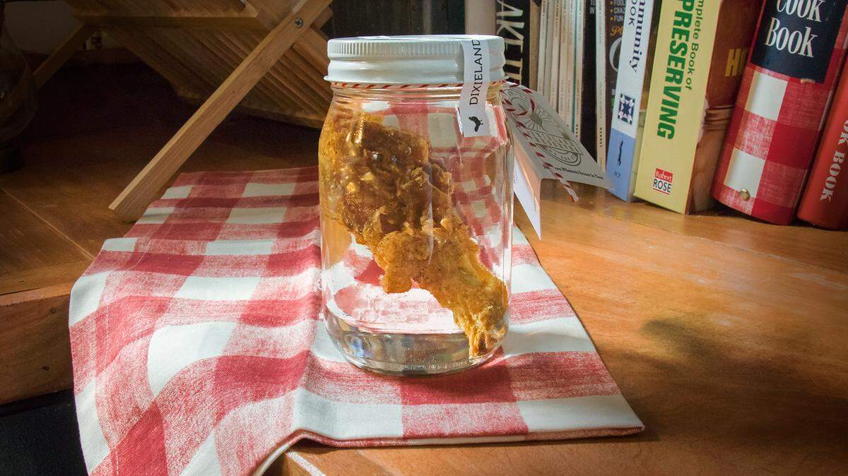 The new Kentucky for Kentucky product features a KFC drumstick that sits inside a 16-ounce mason jar. It is encapsulated by epoxy resin to keep the chicken preserved.