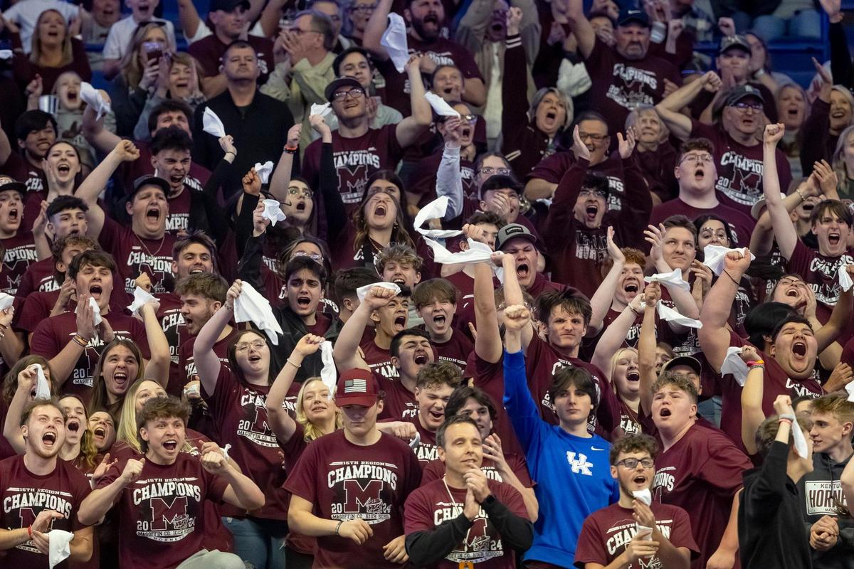 The Magoffin County student section celebrates their Hornets’ first-ever Boys’ Sweet 16 appearance.