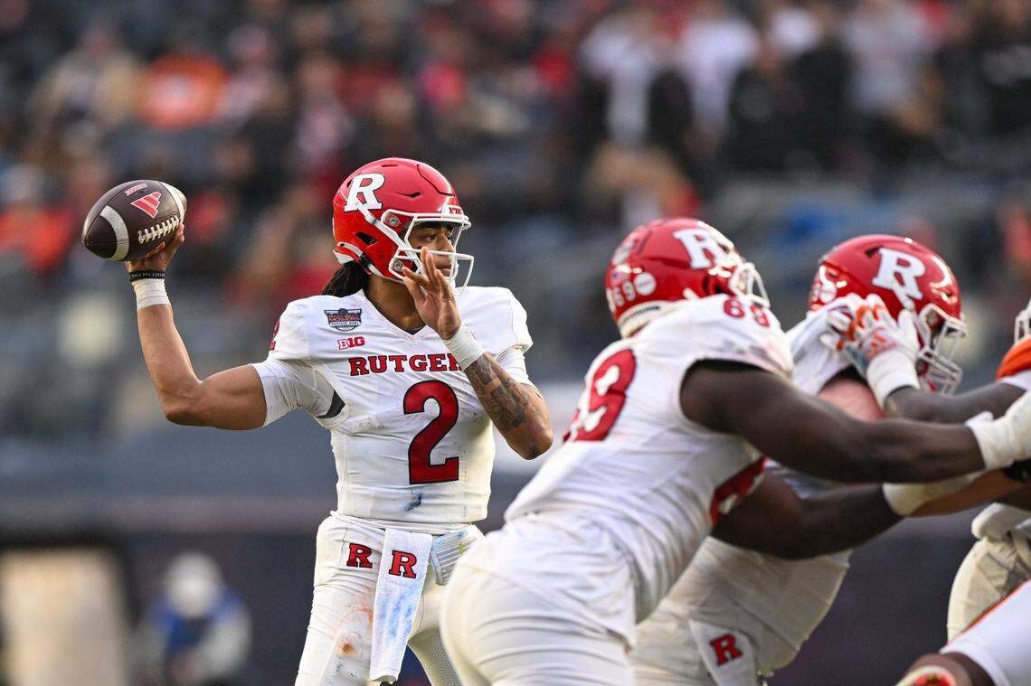 Dec 28, 2023; Bronx, NY, USA; Rutgers Scarlet Knights quarterback Gavin Wimsatt (2) looks to pass the ball against the Miami Hurricanes during the second quarter at Yankee Stadium. Mandatory Credit: Mark Smith-USA TODAY Sports