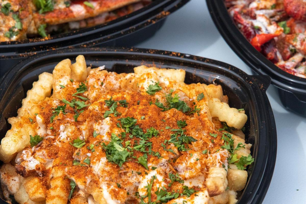Chee-sea fries at Seafood Lady at 833 Georgetown Street in Lexington, Ky., on Thursday, Aug. 28, 2020. The carryout restaurant features Cajun-style seafood boils with lobster, oysters, crabs, shrimp, fish, Southern seafood, plus po’boys and more.