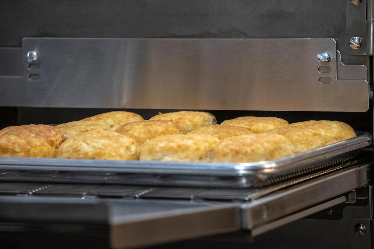 Biscuits come out of an oven Sept. 16 at Tudor’s Biscuit World, which will open the first week of October drive-thru only for now. The 48-seat dining room will open eventually as well, as the COVID pandemic eases.
