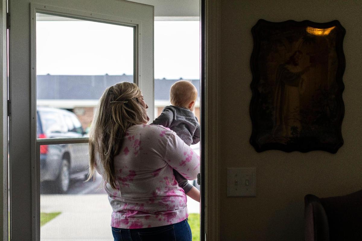Megan Simpson holds her youngest son Jaxson before heading to the playground in Barbourville, Ky., Friday, May 7, 2021. Megan gave birth to Jaxson while on life-support in the hospital for serious heart troubles. She was first diagnosed with endocarditis in 2011 and again in 2019. She was hospitalized in August 2019 and ended up having heart surgery in March 2021. Promising she would stay clean, Megan was told it would potentially be life or death if she relapsed.