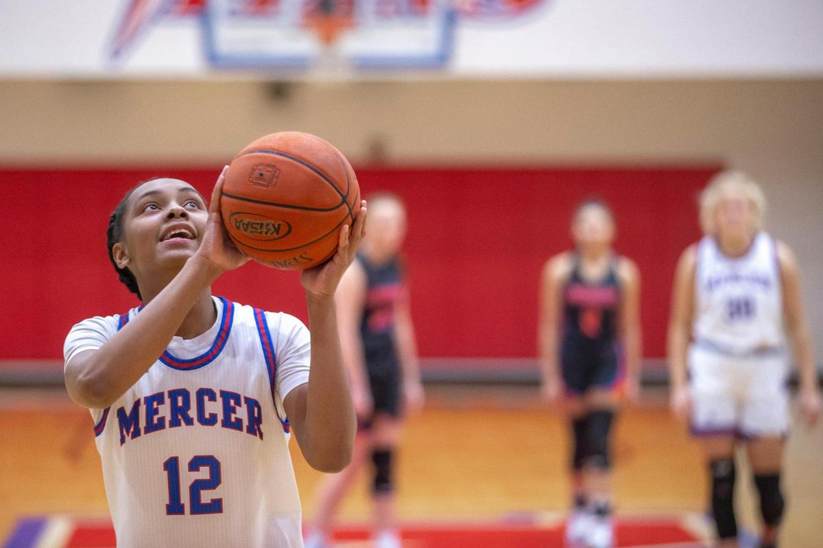 Mercer County’s Timberlynn Yeast (12) shoots the ball after grabbing her 1,000th career rebound at the start of a game against Southwestern at Mercer County High School in Harrodsburg on Thursday. Yeast injured her knee before the season and hasn’t been able to play. The baskets and rebounds were not contested by visiting Southwestern in order for her to achieve the milestone.