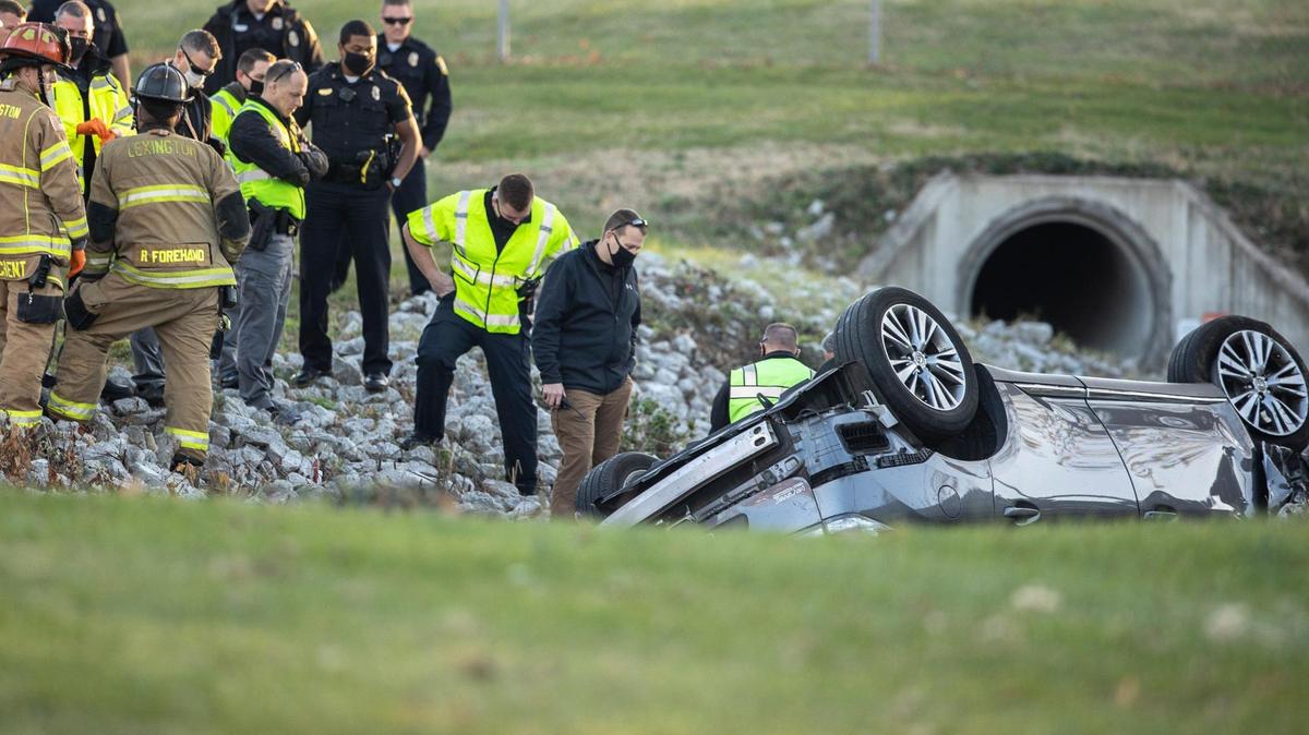 Emergency crews respond to an overturned vehicle near the intersection of Midland Avenue and Midland Place in Lexington, Ky., Friday, Nov. 20, 2020.
