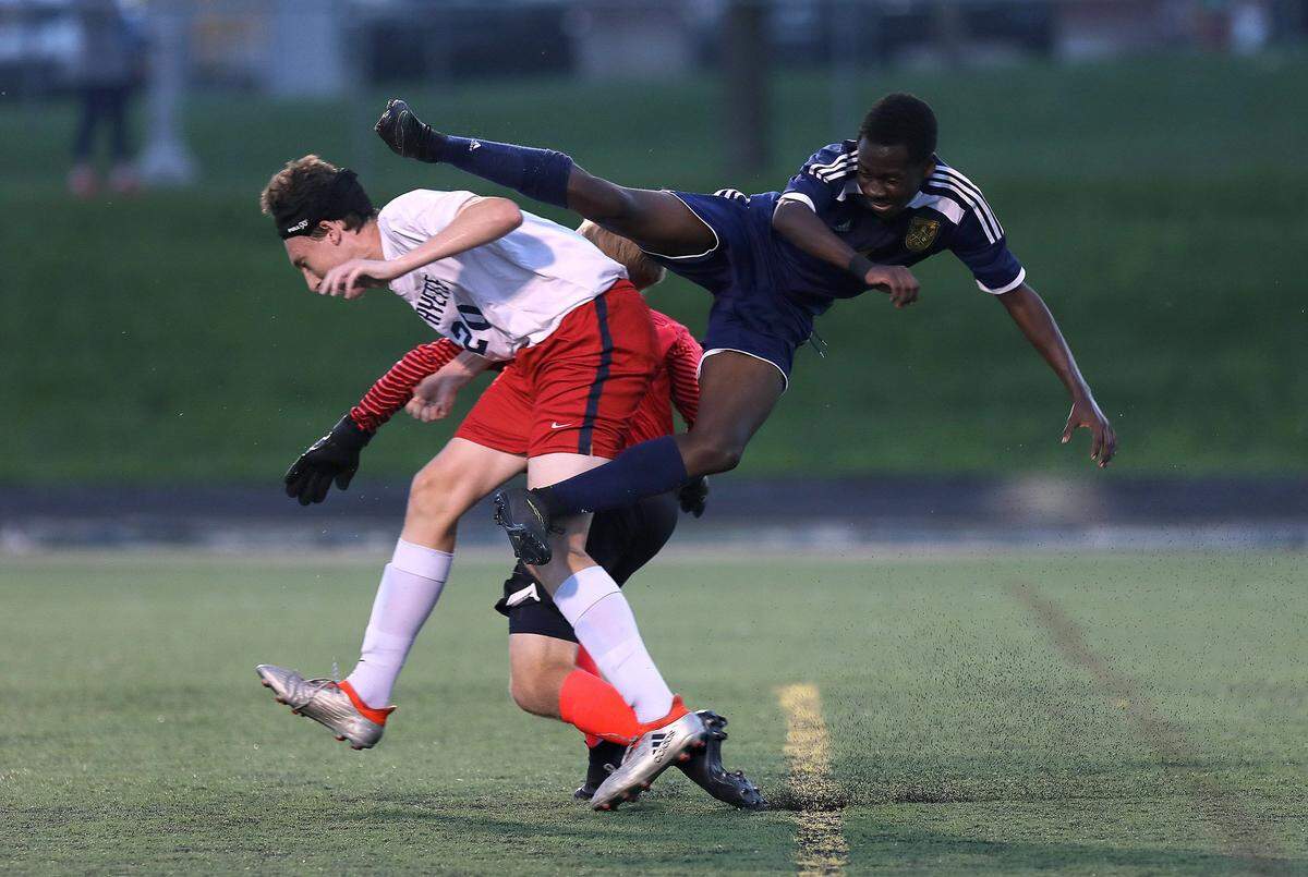 Bryan Station’s Juma Prince was issued a yellow card on this aerial shot against Lafayette’s Jon Reynolds, left, and keeper Justin Puckett at R. L. Grider Stadium on Aug. 21.