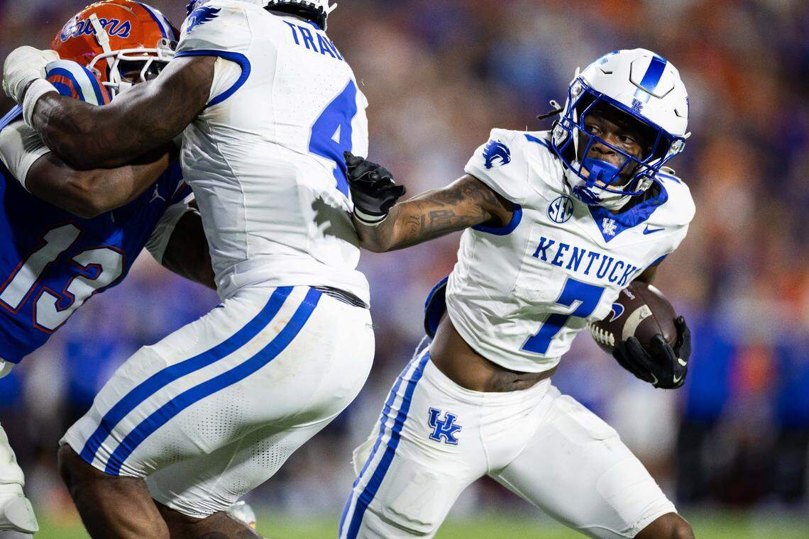 Oct 19, 2024; Gainesville, Florida, USA; Kentucky Wildcats wide receiver Barion Brown (7) pushes past Kentucky Wildcats running back Chip Trayanum (4) against the Florida Gators during the second half at Ben Hill Griffin Stadium. Mandatory Credit: Matt Pendleton-Imagn Images
