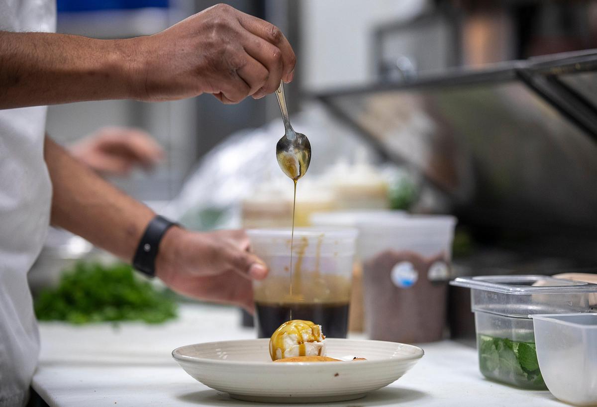 Lawrence Weeks, Honeywood executive chef, drizzled a sorghum syrup a dessert.