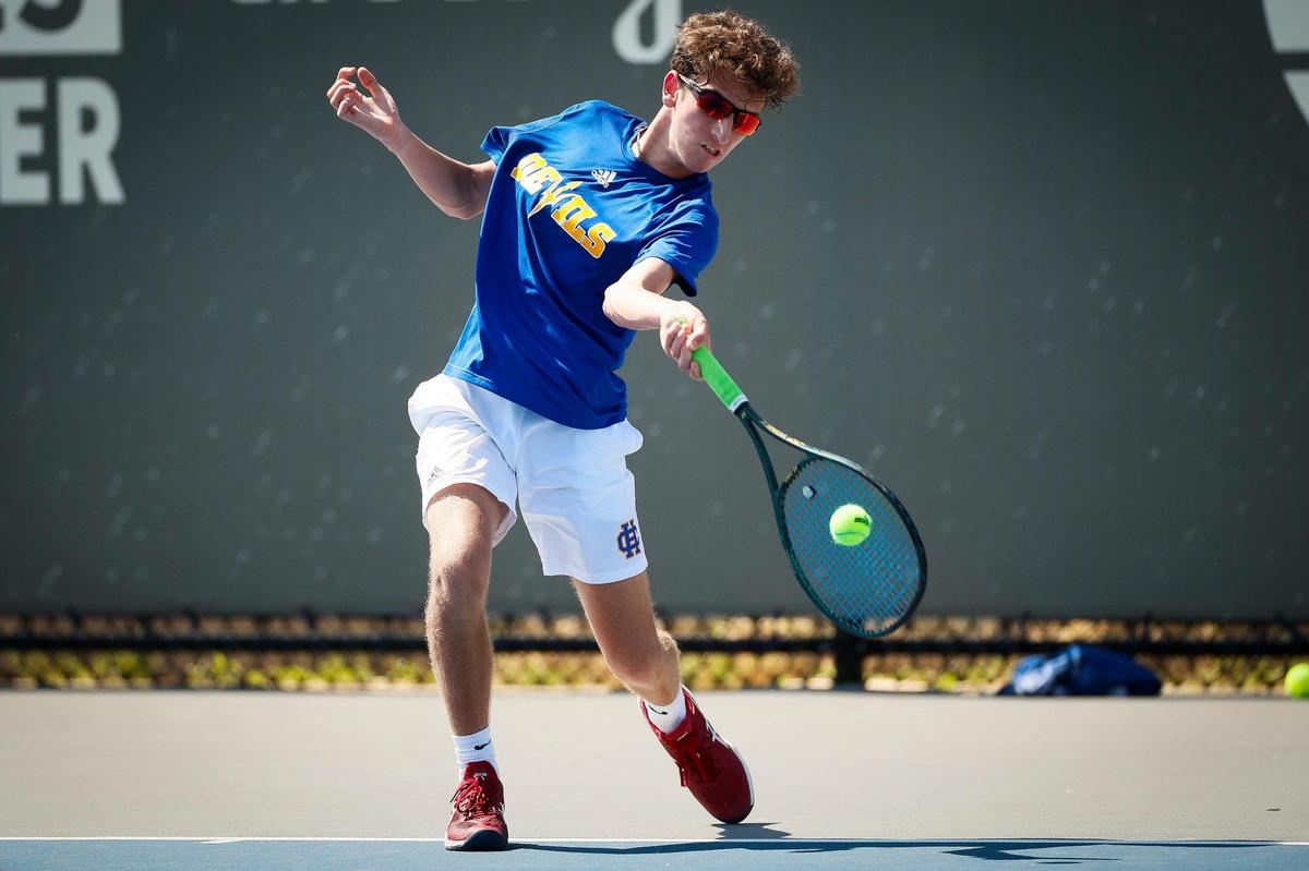 Henry Clay’s Evan Duggal returned the ball during the 11th Region Tennis Tournament boys’ singles finals against Tates Creek’s Zach White at Top Seed Tennis Club in Nicholasville.