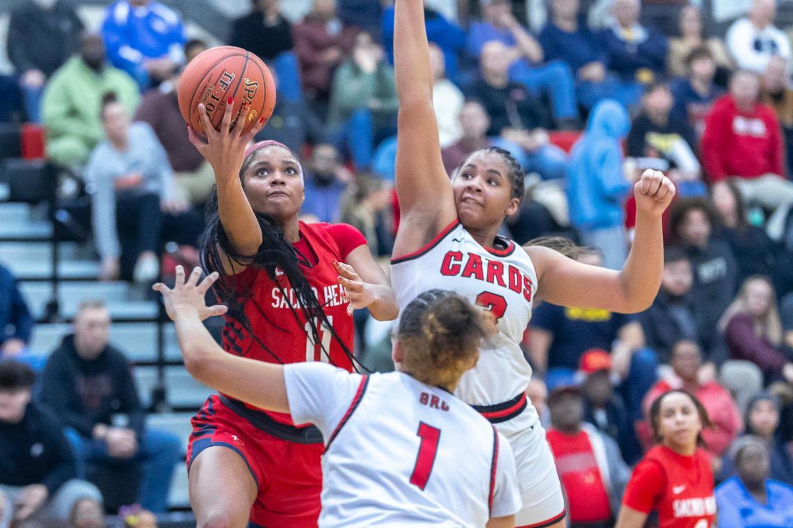 Sacred Heart’s ZaKiyah Johnson (11) and George Rogers Clark’s Ciara Byars (3) are both finalists for this year’s Miss Basketball award.