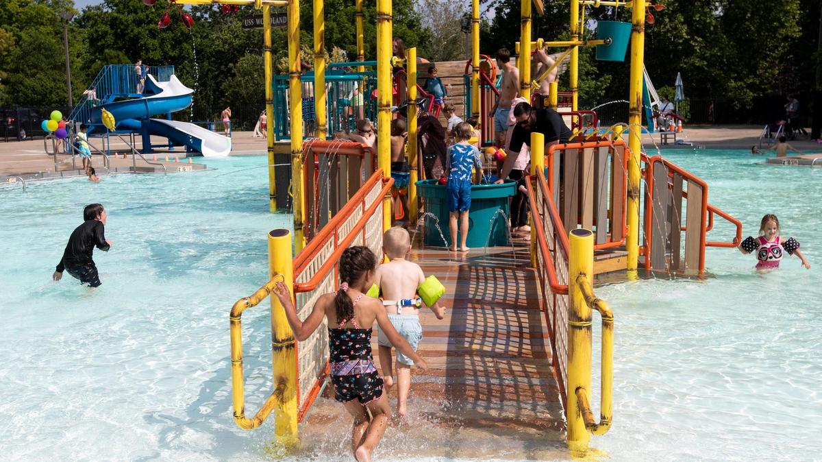 Children play on and near the newest pool feature at the Woodland Aquatic Center: Paradise Lagoon, a shipwreck-themed feature at Woodland Aquatic Center at Woodland Park in Lexington, Ky., Friday, May 26, 2023.