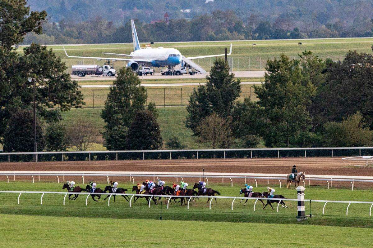 After President Donald Trump’s arrival, Air Force One refueled at Blue Grass Airport in the background during the 10th race at Keeneland on Saturday.