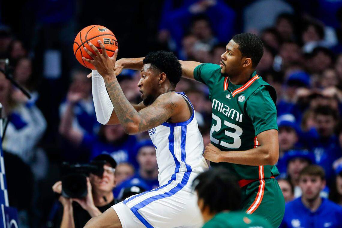 Kentucky’s Justin Edwards grabs a rebound away from Miami’s AJ Casey (23) during Tuesday’s ACC/SEC Challenge game at Rupp Arena. Edwards finished with 11 points, three rebounds and two steals.