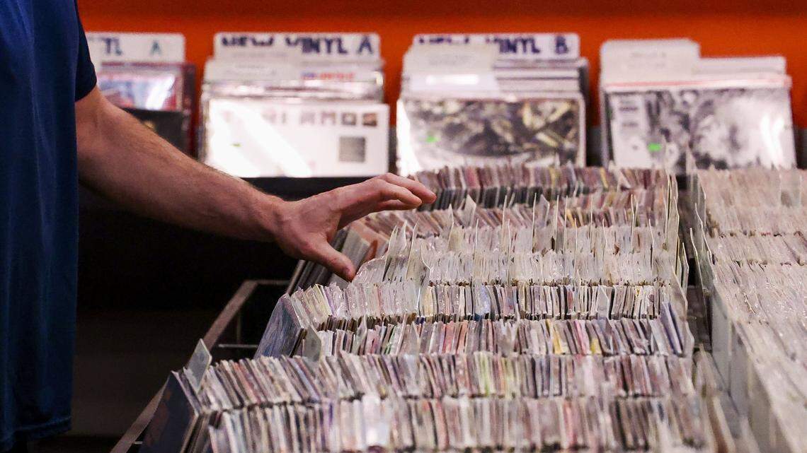 Walker Martin looks through records at CD Central on South Limestone near the UK campus, Wednesday, August. 27, 2025 in Lexington, Ky. Martin was there to buy some classical music. The local music shop is Lexington's longest running record store, opening in 1995.