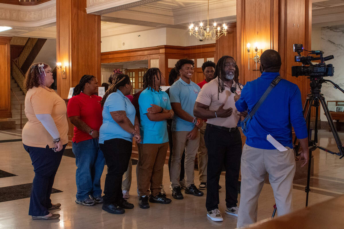 Gerald Gibson, founder of Operation Making a Change, completes a TV interview with his students following the ceremony on Tuesday, July 7, 2026.
