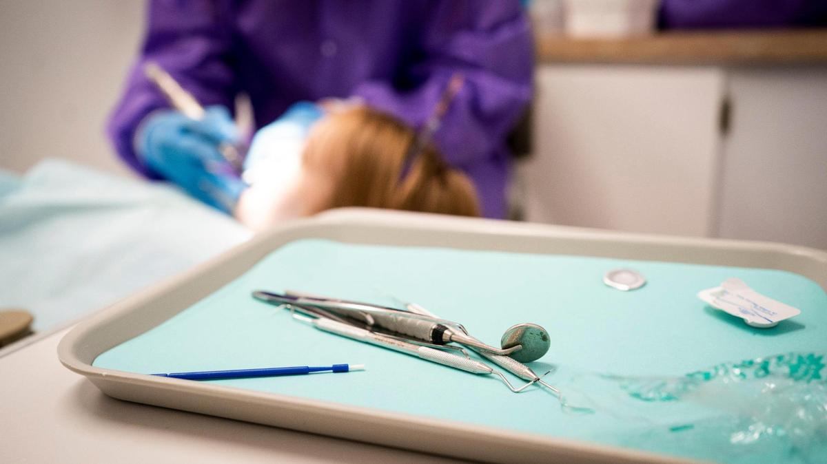 Dental assistant Penny Gray cleans the teeth of Aleeah Mosley, 6, at the Red Bird Dental Clinic in Leslie County, Ky., Friday, June 19, 2020.