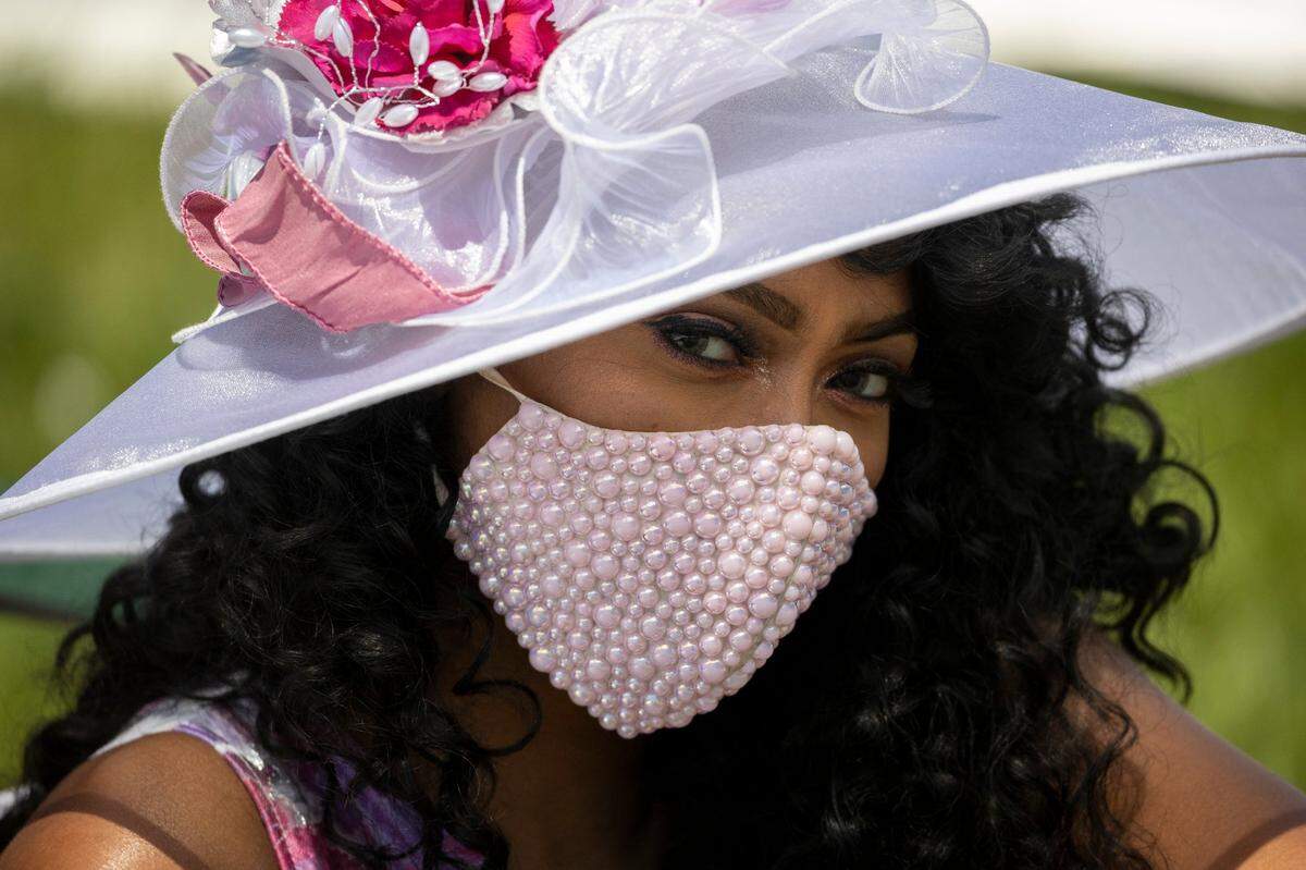 Keri Stallworth of Brandenburg models her custom made mask. Stallworth said she was “bored during the quarantine” and started making fashion masks. A couple of weeks ago she and a friend decided to come to the Derby.