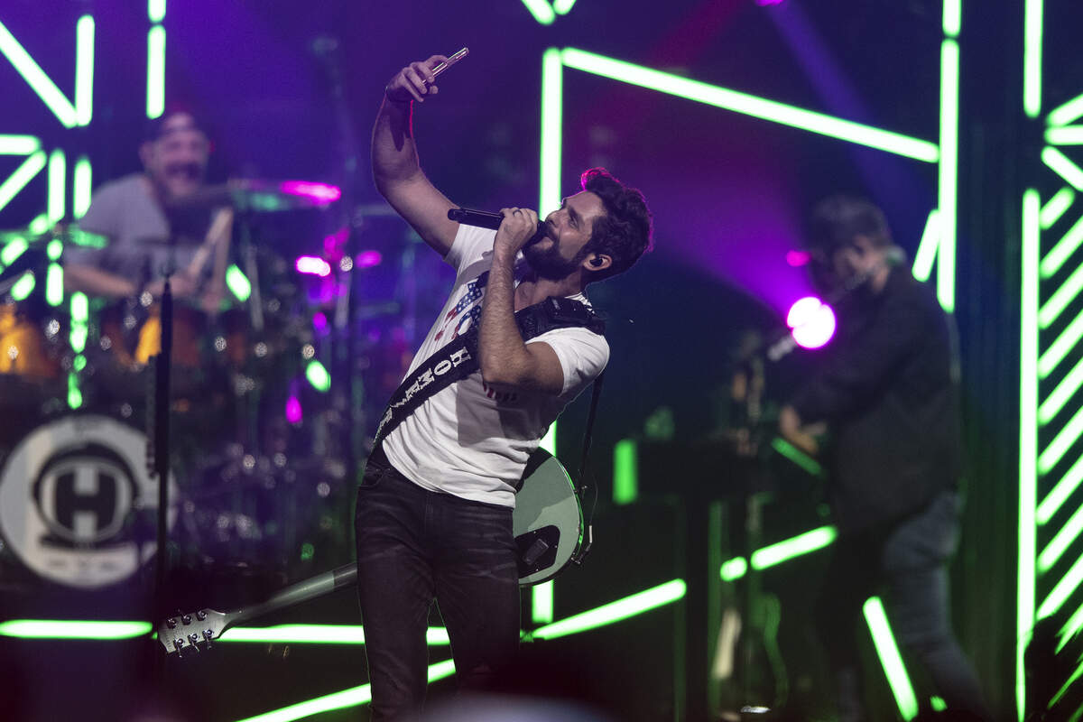 Thomas Rhett takes a selfie on the Rupp Arena stage, Thursday night.