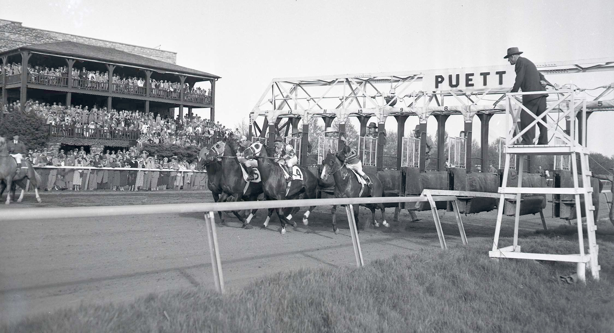 Only four horses competed in the 1949 Blue Grass Stakes on March 28, at Keeneland. Shown here leaving the starting gate are Old Rockport, far left, with Gordon Glisson up, Johns Joy (5), with Johnny Longden onboard, Halt (4) the eventual winner, with Conn McCreary in the saddle, and Wine List, with Toddy Atkinson up, on the inside. Woodvale Farm’s lightly regarded Halt, came from far back to nip Johns Joy at the wire to win the $20,000-added Blue Grass Stakes. Halt, trained by Woody Stephens, went on to place 5th in the follow weekend’s Kentucky Derby. The 93rd running of the annual stakes race now called the Toyota Blue Grass Stakes, will be held this afternoon at the Keeneland Race Track.
