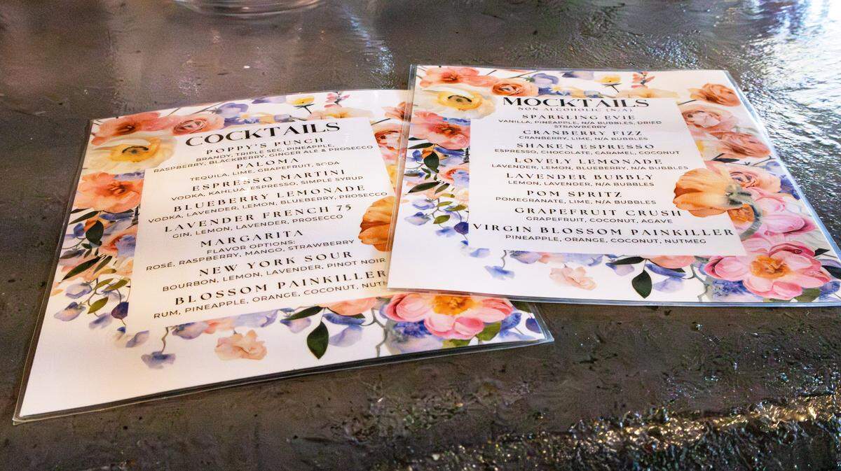 Two of Poppy’s Flower Bar drink menus feating alcoholic beverages and mocktails for purchase  on Oct. 4, 2025, in Lexington, Ky.