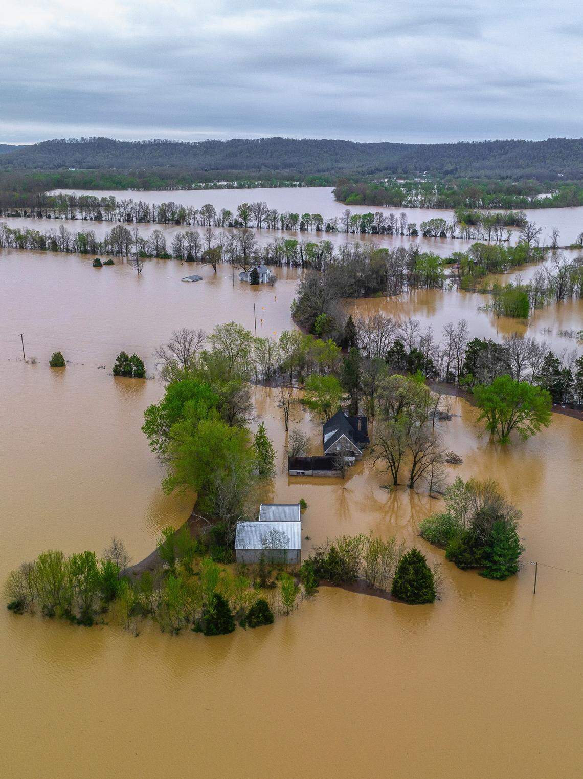 Water floods fields, roads and structures near the Bluegrass Parkway in Nelson County on Monday, April 7, 2025. Flooding inundated much of Kentucky last week, as the western part of the state saw more than 10 inches of rain, and Central Kentucky saw more than 6. Five people died statewide in the flooding.