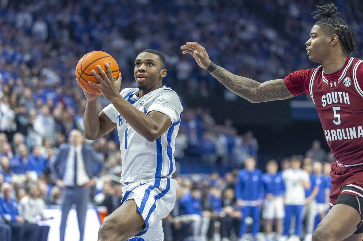 Kentucky guard Lamont Butler (1) shoots the ball as South Carolina forward Nick Pringle (5) defends during Saturday’s game at Rupp Arena.