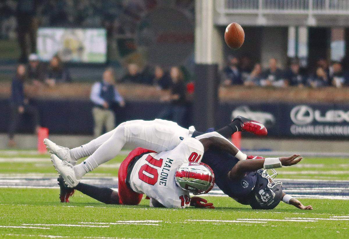 Old Dominion quarterback Stone Smartt is sacked by Western Kentucky’s DeAngelo Malone (10) during a game in 2019. For the second straight season, Malone was voted the C-USA Preseason Defensive Player of the Year.