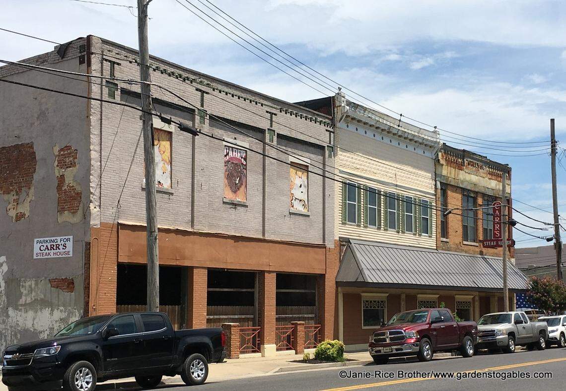 The historic buildings that housed Carr’s Steakhouse, shown at far left, on West Broadway in July 2018.