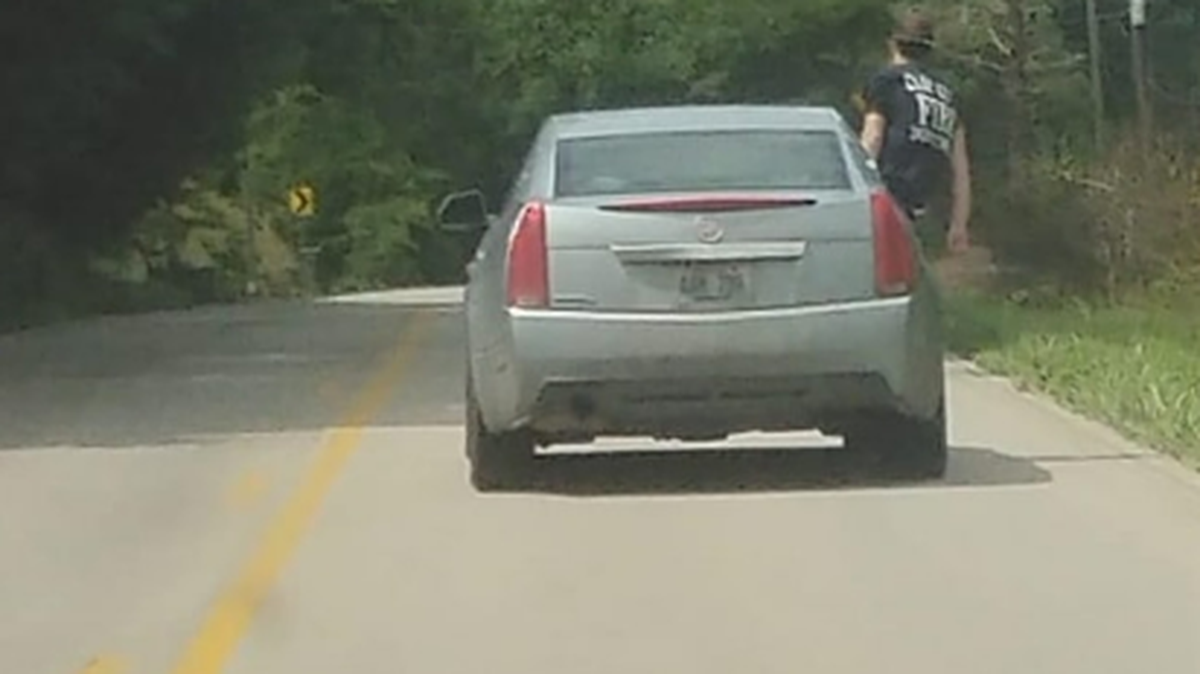 The Clay City Fire Department shared a Facebook post of a firefighter sitting on the outside of a moving car after it went viral.
