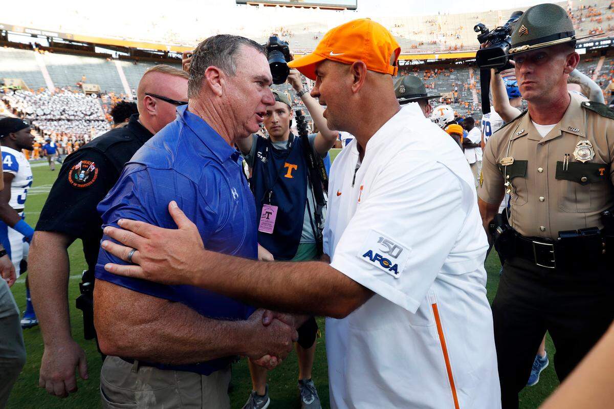 Tennessee Coach Jeremy Pruitt, right, shook hands with Georgia State head man Shawn Elliott after the Panthers stunned UT 38-30 at Neyland Stadium in the 2019 season opener.