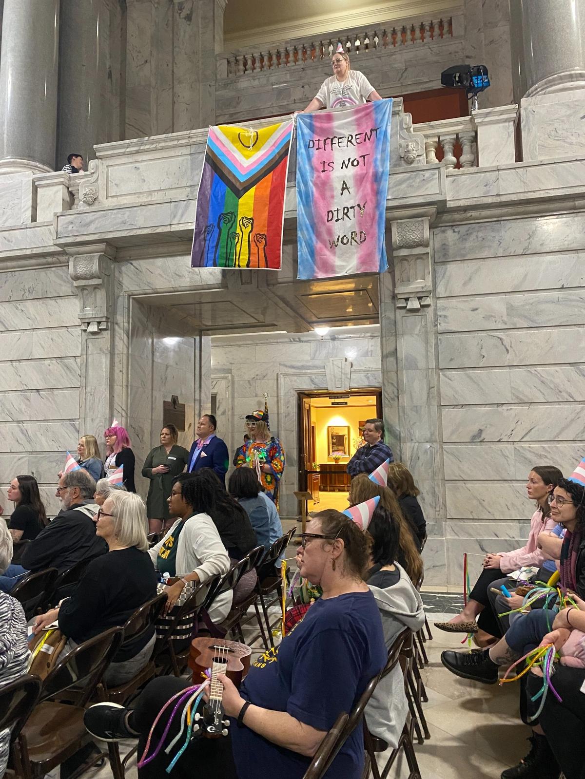 A crowd of LGBTQ allies and advocates gathered in the Capitol rotunda Thursday to protest a bill, now law, that protects conversion therapy and blocks the use of Medicaid dollars for gender-affirming health care for trans adults.