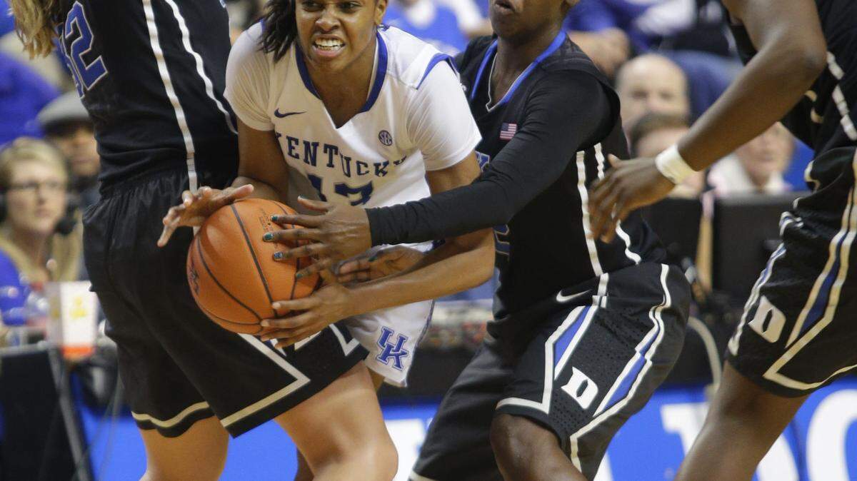 Wildcats guard Bria Goss (13) got caught in the teeth of the Duke defense as the No. 2 Blue Devils defeated No. 5 Kentucky in front of a record crowd of 23,706. Kentucky appeared to struggle against Duke's superior size.